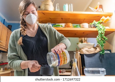 Coronavirus. Isolated Pretty Woman With Face Mask On Quarantine, Cooks In The Kitchen At Home During Coronavirus Crisis. Stay At Home. Enjoy Cooking At Home. Family Concept.
Beautiful Rustic Kitchen.