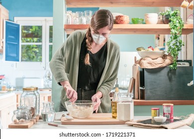 Coronavirus. Isolated Pretty Woman With Face Mask On Quarantine, Cooks In The Kitchen At Home During Coronavirus Crisis. Stay At Home. Enjoy Cooking At Home. Family Concept.
Beautiful Rustic Kitchen.