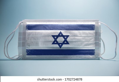 Coronavirus In Israel Concept.Grunge Texture Israel Flag Printed On Surgical Protective Mask.Impact Of Pandemic Virus To Israel Economy.Covid -19 Spread Around Israel .covid-19 