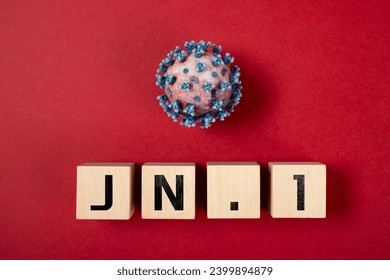coronavirus and JN.1 variant on a red background