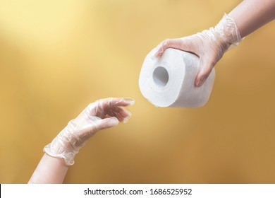 Coronavirus Meme Concept: Creation Of Adam Like Hands Holding Toilet Paper Wearing Latex Gloves On Beige Background
