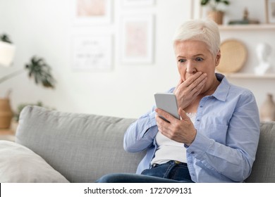 Coronavirus News. Shocked Senior Woman Reading Information On Smartphone At Home, Afraid Of Covid-19 Statistics, Free Space