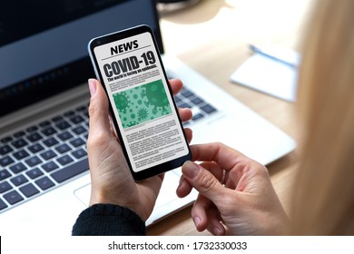 Coronavirus News. Woman with smartphone in her hands reading about covid-19 virus. Online newspaper page in the screen.  Breaking news.