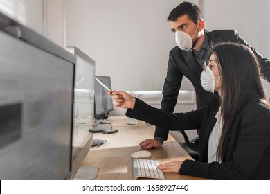 Coronavirus Office Workers With Mask For Corona Virus. Business Workers Wear Masks To Protect And Take Care Of Their Health. Office Working With Computer. Working From Home. 