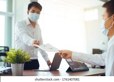 Coronavirus Office Workers With Mask For Corona Virus. Business Workers Wear Masks To Protect And Take Care Of Their Health. Office Working With Computer.