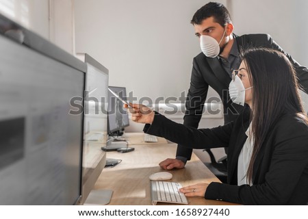 Coronavirus Office workers with mask for corona virus. Business workers wear masks to protect and take care of their health. Office working with computer. Working from home. 
