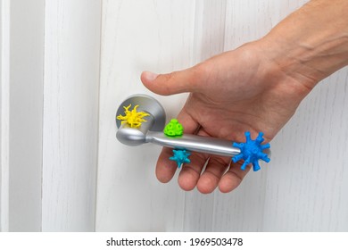 Coronavirus And Other Germs On The Doorknob. A Man With His Hand Grabs An Infected Handle.