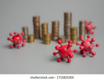 Coronavirus Outbreak In 2019,Flu COVID-19 Virus Cell With Coins Money On A Gray Background,Covid-19 Affecting The Global Economy Concept.