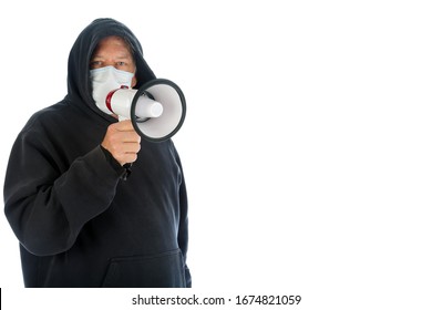 Coronavirus Outbreak. COVID-19. A Man Wears A Paper Face Mask With A MEGAPHONE. Coronavirus2019 Text. 2019-ncov Flu Strain Cases A World Wide Pandemic. Dangerous Medical Health Risk. 2019-nCoV. 