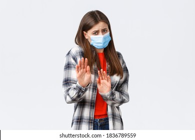 Coronavirus Outbreak, Leisure On Quarantine, Social Distancing And Emotions Concept. Stay Away From Me. Woman Step Back And Asking Keep Distance From Sick Person, Worried Catching Covid-19