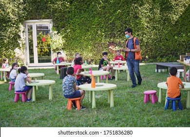 Coronavirus outbreak lifestyle:  outdoor summer school activities with social distancing measures. Turin, Italy - June 2020