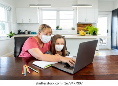 Coronavirus Outbreak. Lockdown And School Closures. Mother Helping Bored Daughter With Face Mask Studying Online Classes At Home. COVID-19 Pandemic Forces Children And Teachers Online Learning.