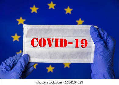 Coronavirus Outbreak. Coronavirus Update In Europe. Word Covid-19 On Medical Mask With Flag Of EU On Background. Spread Of Corona Virus In World. Wuhan Virus. Stay At Home During Quarantine.