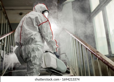 coronavirus pandemic, disinfection against COVID-19 virus. professional disinfector in protective clothing, suit fight with pandemic health risk, remove bacterias and infections use special equipments - Powered by Shutterstock