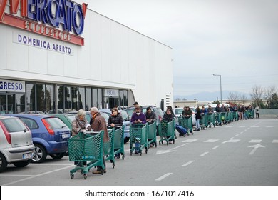 Coronavirus Pandemic Effects: Long Queue To Enter The Supermarket For Grocery Shopping. Milan, Italy - March 2020