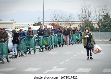 Coronavirus Pandemic Effects: Long Queue To Enter The Supermarket For Grocery Shopping. Milan, Italy - March 2020