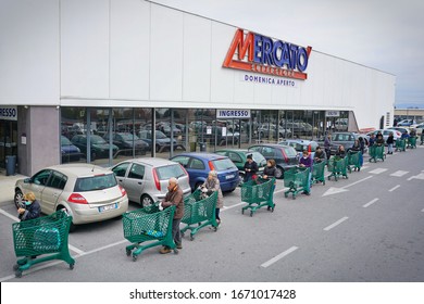 Coronavirus Pandemic Effects: Long Queue To Enter The Supermarket For Grocery Shopping. Milan, Italy - March 2020