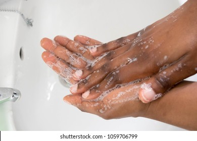 Coronavirus pandemic prevention wash hands with soap warm water and rubbing nails and fingers washing frequently or using hand sanitizer gel.