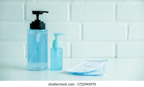 Coronavirus prevention alcohol gel clean hand sanitizer and medical surgical masks hygiene corona virus protection - Shutterstock ID 1722945970