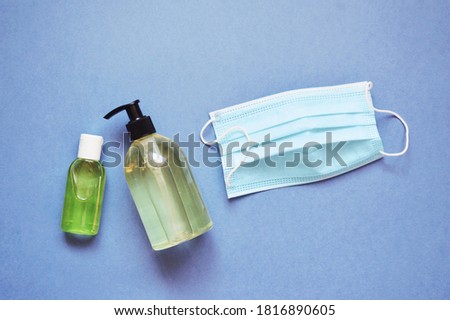 Coronavirus prevention, hand hygiene and wearing facemask. Sanitizer gel bottle, liquid soap and disposable face mask