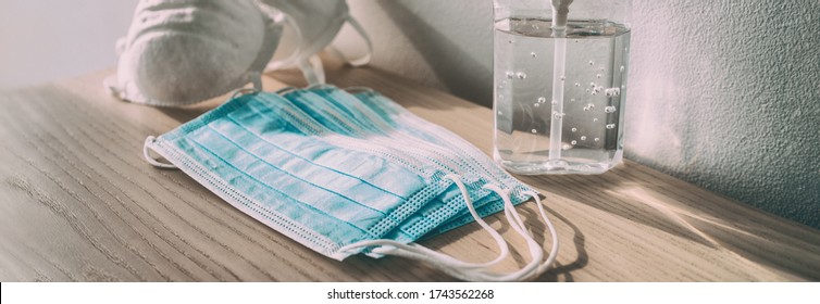 Coronavirus prevention medical surgical masks and hand sanitizer gel bottle dispenser for Covid-19 corona virus protection. Panoramic of PPE. - Powered by Shutterstock