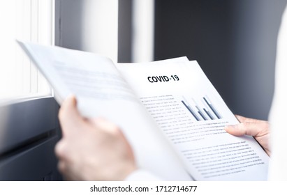 Coronavirus Report About Patient Information Or Covid 19 Impact On Business Finance Market. Doctor Reading Virology Laboratory Research And Test Result. Medical Record, Death Data Or Economy Graph.