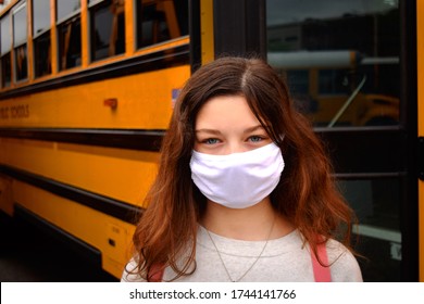 Coronavirus School Reopening: Child Student Wearing Face Mask Taking A School Bus To Class. For Education, Health, Medical, Environmental, Back To School, And Safety Concepts. 