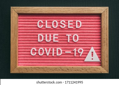 Coronavirus store closure sign. Closed due to COVID-19 message board for retail business COVID-19 pandemic outbreak. Government shutdown of restaurants, bakeries, non essential services. Pink letters. - Powered by Shutterstock