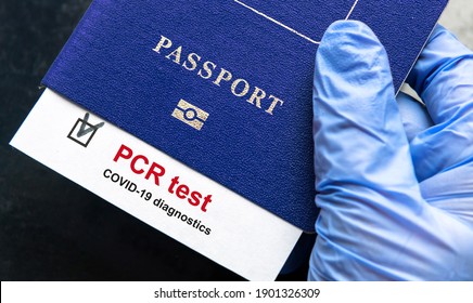 Coronavirus and travel concept, mark of COVID-19 PCR testing in tourist passport. Diagnostics of COVID disease in airport due to lockdown. Business and tourism hit by corona virus during pandemic.
