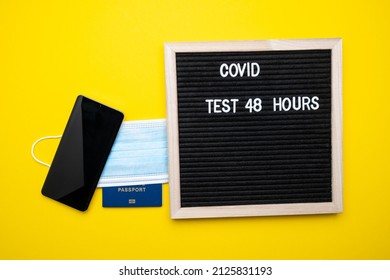 Coronavirus Travel Concept. Passport Mask And Money On A Yellow Background. Text Covid 48 Hours.