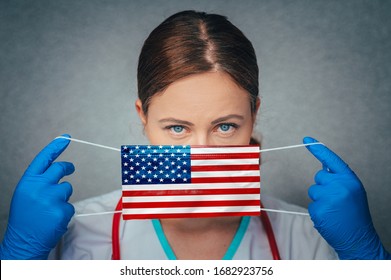 Coronavirus, Covid–19 In USA, United States Of America. National Flag. Ilustration Photo. Portrait Of Young Female Doctor Apply Surgery, Protect, Medical Mask. 