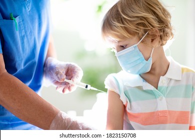 Coronavirus Vaccination. Covid-19 Vaccine. Doctor Vaccinating Child. Kids At Clinic. Little Boy Getting Flu Shot. Pediatrician Examining Kid And Giving Injection. Virus Prevention. Health Care.