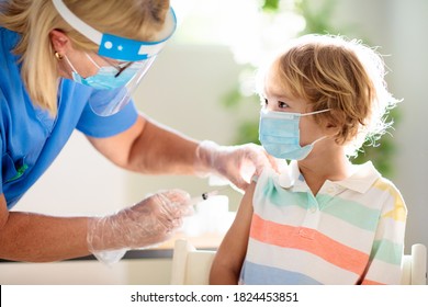 Coronavirus Vaccination. Covid-19 Vaccine. Doctor Vaccinating Child. Kids At Clinic. Little Boy Getting Flu Shot. Pediatrician Examining Kid And Giving Injection. Virus Prevention. Health Care.