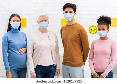 Coronavirus Vaccination. Group Of Covid-19 Vaccinated Diverse Patients In Face Masks Standing In Hospital, Looking At Camera. Covid Infection Immunization, Corona Virus Vaccine Concept - Powered by Shutterstock