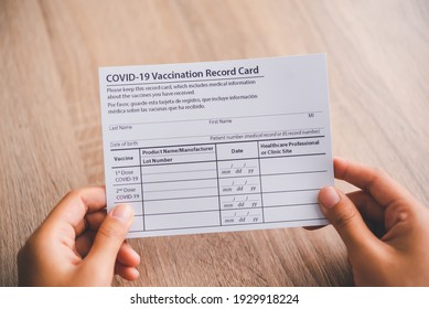 Coronavirus Vaccination Record Card Is Held In Hand. Patient Who Has Already Been Vaccinated With Coronavirus .Coronavirus Prevention