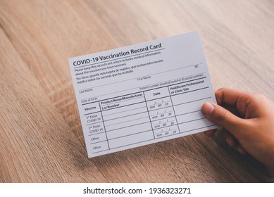 Coronavirus Vaccination Record Card Is Held In Hand. Patient Who Has Already Been Vaccinated With Coronavirus .Coronavirus Prevention	
