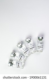 Coronavirus Vaccine Bottle Flipped Isolated On Black Background. Covid-19 Situation Disease Pharmacy In Laboratory And Drug To Cure People.  Healthcare And Medical Concept. Development Of Research.