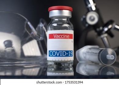 coronavirus vaccine vial displayed on glass shelf in laboratory - Shutterstock ID 1753531394