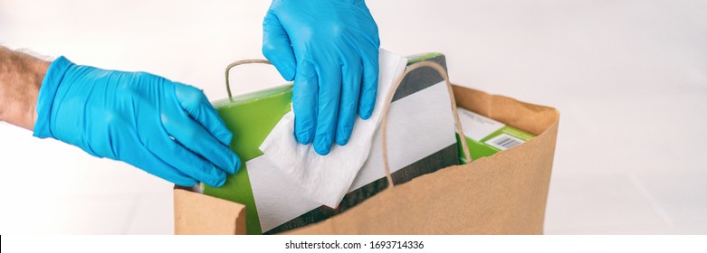 Coronavirus Wiping Down Grocery Packages After Receiving Home Delivery Wearing Gloves, Using Disinfecting Sanitizing Wipes To Wipe The Surfaces Clean. Cleaning Of COVID-19 Virus.