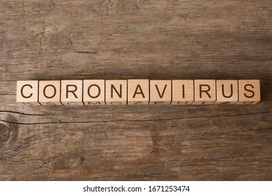 Coronavirus Word On Wooden Toy Cubes. New Official Coronavirus Name Adopted By World Health Organisation Is COVID-19