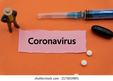 Coronavirus.The Word Is Written On A Slip Of Colored Paper. Health Terms, Health Care Words, Medical Terminology. Wellness Buzzwords. Disease Acronyms.