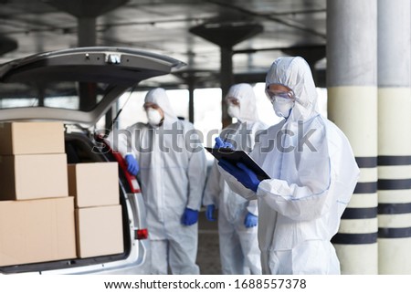 Coronavirus, World Pandemic, Covid-19. Virologists delivering vaccine to people on car, copy space