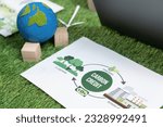 Corporate business company plan and research paper on reducing CO2 emission and carbon credit by renewable clean energy technology utilization on meeting table as hub of eco innovative idea. Quaint