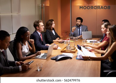 Corporate Business People At An Evening Boardroom Meeting