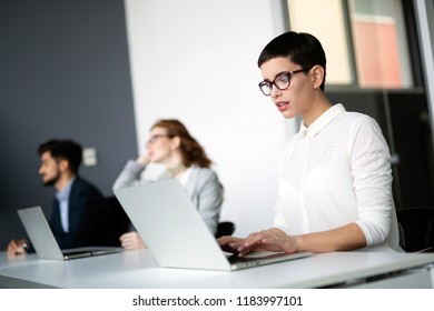 Corporate business team and manager in a meeting - Shutterstock ID 1183997101