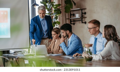 Corporate business team and manager in meeting, discussing renewable energy options for business. - Powered by Shutterstock