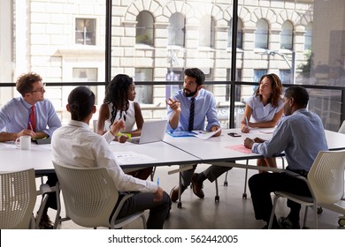 Corporate business team and manager in a meeting, close up - Shutterstock ID 562442005