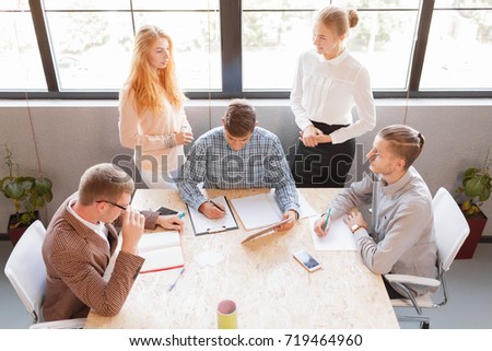 Corporate business team and manager in a meeting, close up. Entrepreneurs and business people conference in modern meeting room.