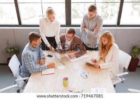 Corporate business team and manager in a meeting, close up. Entrepreneurs and business people conference in modern meeting room.