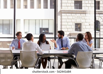 Corporate Business Team Meeting In A Modern Open Plan Office